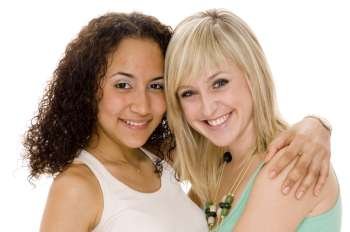 Portrait of two teenage girls hugging each other