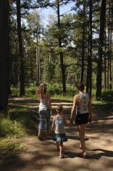 Family walking down dirt road
