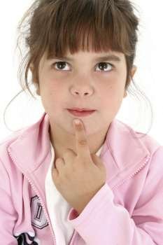 Beautiful five year old girl in pink thinking with finger on chin. Shot in studio over white.