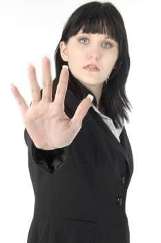 Business woman with hand out, palm open, toward camera. Focus on hand.