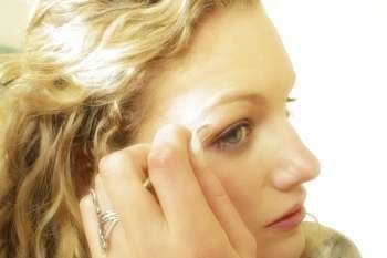 Woman applying eye make up