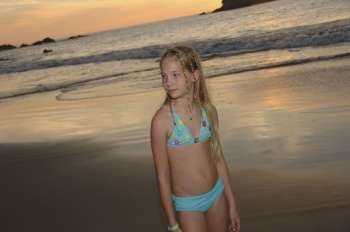 Blonde girl posing on beach
