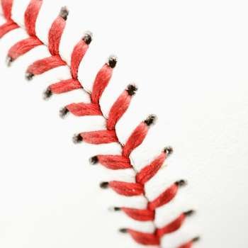Detail of stitching on baseball.