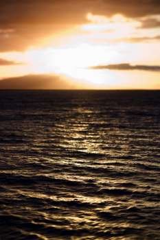 Sunset view of ocean and Kihei island in Maui, Hawaii, USA.