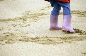 child´s welly boots on beach