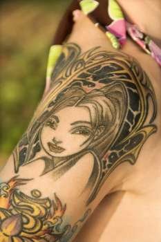 Close up of tattoo on shoulder of Caucasian woman.