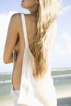 Portrait of pretty Caucasian woman posing on Maui, Hawaii beach.