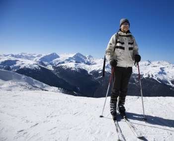 Caucasian senior man skier on slopes.