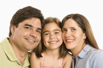 Parents and daughter smiling against white background.