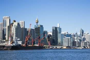 Downtown Sydney, Australia with view of cargo ship and harbour.