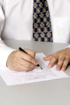 A business man filling out a form