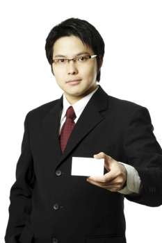 A businessman holding a blank business card