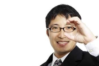 Businessman with a hand formed like a binocular, suitable for business vision concept
