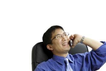 A shot of businessman talking on the phone (isolated)