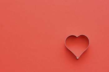 Heart symbol in red, symbolizes love/romance