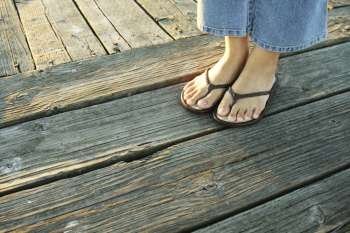 A woman´s feet on a boardwalk