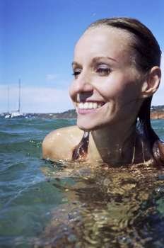 A stock photograph of a beautiful young woman´s portrait in the water.