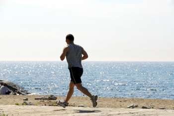 Man jogging in a beach