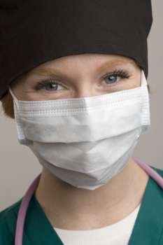 Young female doctor wearing mask