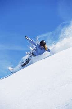 Snowboarder coming down hill