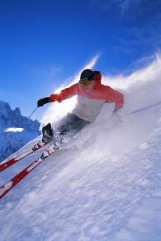 Skier coming down snowy hill (blur)