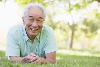 Man relaxing outdoors smiling