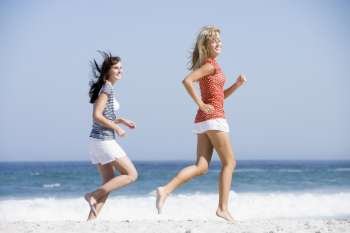 Women jogging on a beach