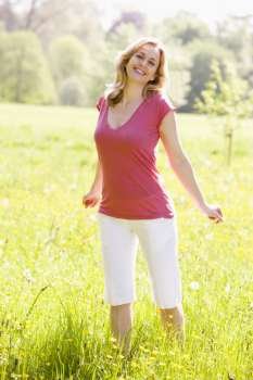Woman standing outdoors smiling