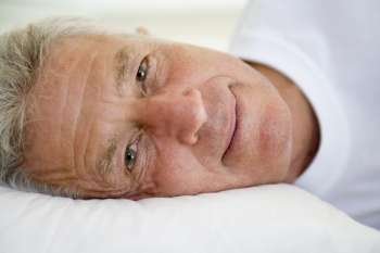 Man lying in bed