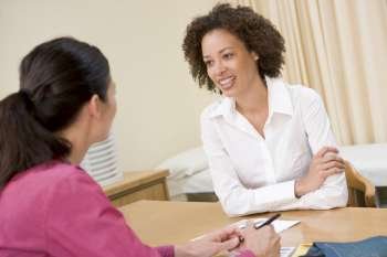 Woman in doctor´s office smiling