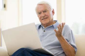 Man in living room with laptop