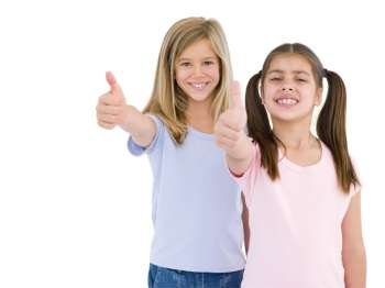 Two girl friends giving thumbs up smiling