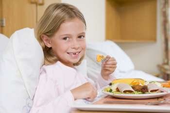 Young Girl Eating Hospital Food