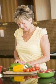 Woman Cutting Up Vegetables