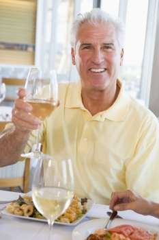 Man Enjoying meal,mealtime With A Glass Of Wine 