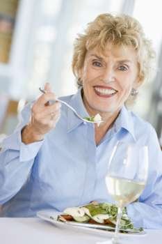 Woman Enjoying meal,mealtime With A Glass Of Wine