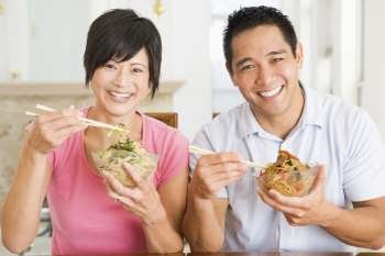 Young Couple Enjoying Chinese Food