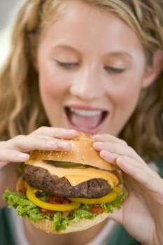 Teenage Girl Eating Burgers 