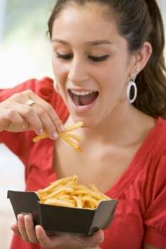 Teenage Girl Eating French Fries 