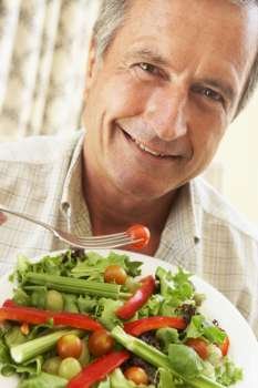 Senior Man Eating A Healthy Salad