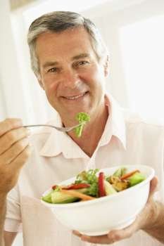Middle Aged Man Eating A Healthy Salad