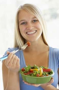 Teenage Girl Eating Fresh Salad