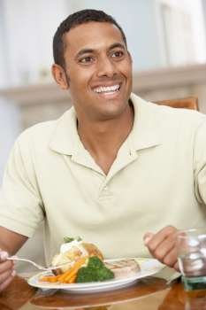 Man Enjoying A Meal At Home