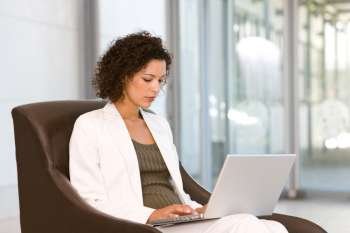 portrait of a business woman sitting with laptop