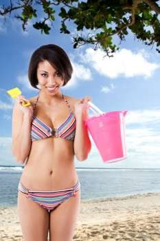 A beautiful black woman in bikini at the beach