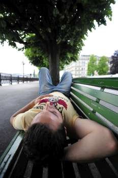 Man having a rest on a banc 