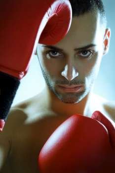 boxer in red gloves looking at camera 