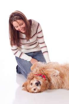 Cute young woman with her purebred Golden Retriever 