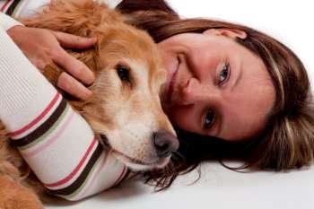 Cute young woman with her purebred Golden Retriever 