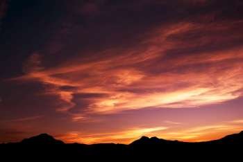 high mountain silhouette with beautiful colorful clouds. 
